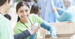 Volunteers packing food in boxes